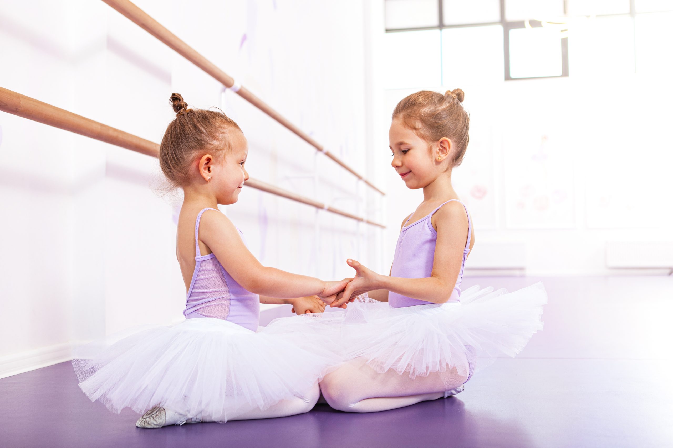 Two adorable little ballerinas at dance class